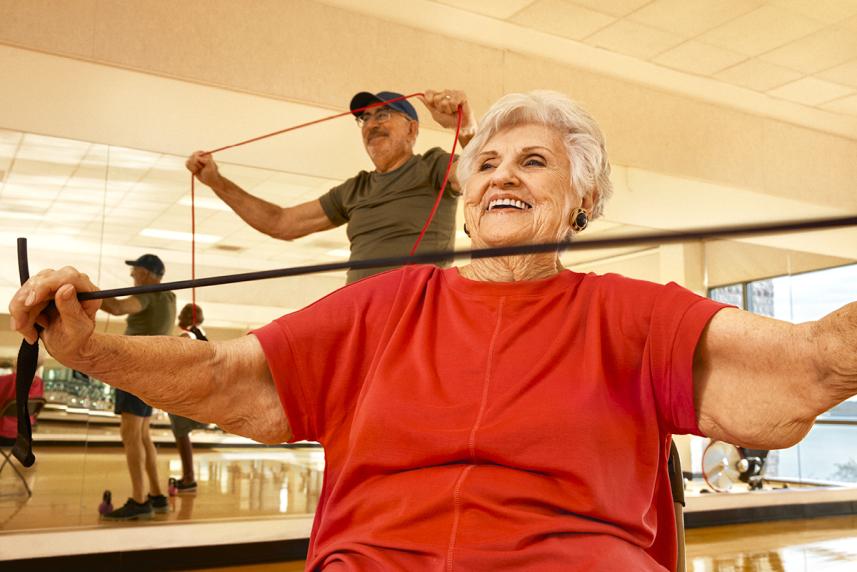 Man and woman stretching in workout class