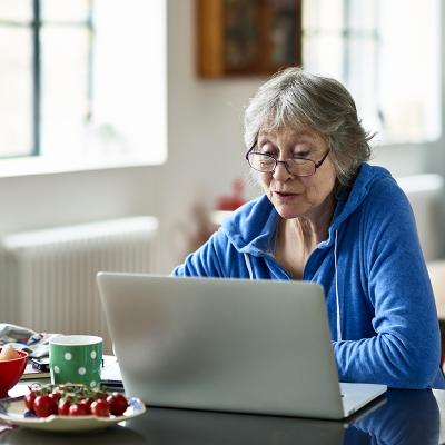 Older woman looking at a laptop