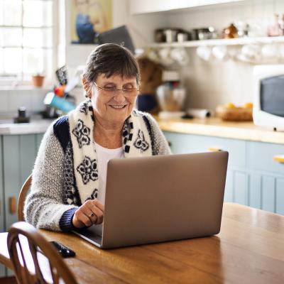 Older woman looking at a laptop