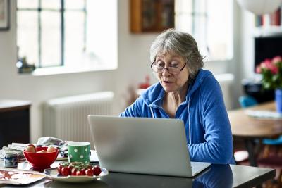 Older woman looking at a laptop