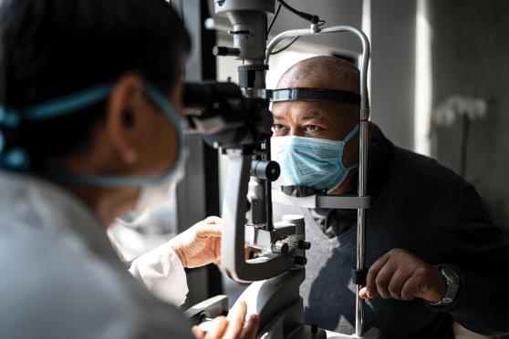 doctor performing eye exam