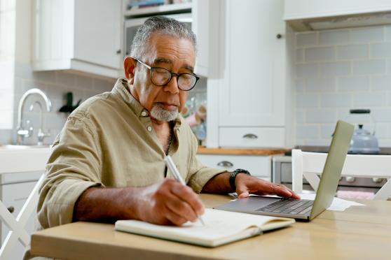 Man writing in a notebook